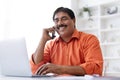 Closeup middle aged indian man working from home office Royalty Free Stock Photo