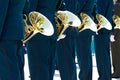 Closeup military musicians in green uniform and white gloves stand