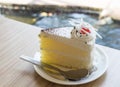 Closeup milk cake on wood table in coffee shop