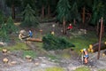 Closeup of mini-figures of people cutting trees in a forest. Museum of miniatures in Wroclaw.