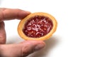 mini tartlet with strawberry jam in hand on white background Royalty Free Stock Photo