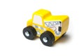 Miniature toy, wooden yellow tow truck on white background Royalty Free Stock Photo