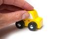 miniature wooden car in hand on white background Royalty Free Stock Photo