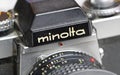 Closeup Minolta XE-5 single lens analog film reflex camera, aperture adjustment ring and depth of field scale