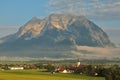 Closeup of misty sunrise on Irdning Village and Grimming Peak of Dachstein Mountains, Alps Alpes, Alpen, Alpi, Alps, Austria