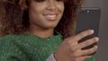 Closeup of mixed race black woman with movil phone