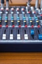 Closeup mixer in recording room. Closeup button to increase or decrease sound Royalty Free Stock Photo