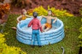 Closeup of model figures in a hot tub Royalty Free Stock Photo