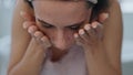 Closeup model washing skin with water home. Portrait smiling girl cleaning face