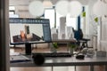 Closeup of modern architect desk with workstation showing 3d blueprints Royalty Free Stock Photo