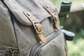 Closeup of a modern backpack with leather straps under the sunlight with a blurry background Royalty Free Stock Photo