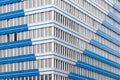 Closeup of a modern blue and white office building at daytime Royalty Free Stock Photo