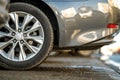 Closeup of a modern cars parked on a side of a city street on a sunny day Royalty Free Stock Photo