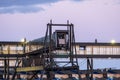 closeup of a modern cruise ship terminal with a glass passenger boarding bridge against a vivid sky during the sunset Royalty Free Stock Photo