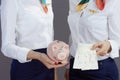 Closeup on modern female air hostesses isolated on gray Royalty Free Stock Photo