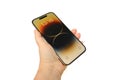 Closeup modern gadget apple in male hands, testing new gold smartphone iPhone 14 Pro Max with Super Retina display, Mobile device