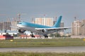 Closeup of modern passenger airplane ready for landing on runway at the airport in summer Royalty Free Stock Photo