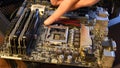 Closeup of motherboard hardware with empty space for CPU