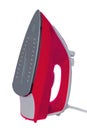 Closeup of a modern red electric steam iron for ironing household laundry. Macro photograph Royalty Free Stock Photo