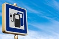 Road sign for an Electric Vehicle Charging Station on Blue sky with Clouds Royalty Free Stock Photo