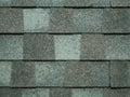 Closeup of modern roof trapezoid square shingles tiles in gray color. waterproof scabrous rough surface for house exterior cover Royalty Free Stock Photo