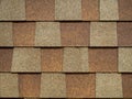 Closeup of modern roof trapezoid square shingles tiles. waterproof scabrous rough surface for house exterior cover