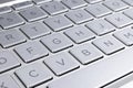 Closeup of a modern silver laptop computer keyboard. Laptop keyboard. Detail of the new and ergonomic computer keyboard Royalty Free Stock Photo