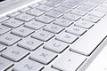 Closeup of a modern silver laptop computer keyboard. Laptop keyboard. Detail of the new and ergonomic computer keyboard Royalty Free Stock Photo