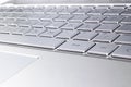 Closeup of a modern silver laptop computer keyboard. Laptop keyboard. Detail of the new and ergonomic computer keyboard Royalty Free Stock Photo