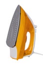 Closeup of a modern yellow electric steam iron for ironing household laundry. Macro photograp Royalty Free Stock Photo