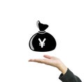 Closeup a money bag in yen currency on working woman hand isolated on white background in business concept with clipping path