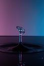 Closeup monochrome shot of water droplets against a blue and purple background Royalty Free Stock Photo