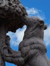 Closeup Monument of the Bear and Arbutus at Puerta del Sol, against blue sky. They are the symbol of the city of Madrid, Spain Royalty Free Stock Photo