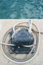 Closeup of a mooring bollard and rope Royalty Free Stock Photo