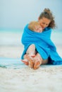 Closeup on mother and baby girl wrapped in towel Royalty Free Stock Photo