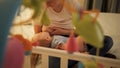 Closeup of mother breastfeeding her baby son on bed at night Royalty Free Stock Photo