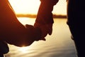 Closeup of mother and child hands at the sunset Royalty Free Stock Photo