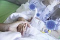 Closeup mother hand hold child patient with saline solution in hospital