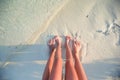 Closeup mother and kid feet on white sand beach Royalty Free Stock Photo