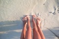 Closeup mother and kid feet on white sand beach Royalty Free Stock Photo