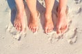 Closeup mother and kid feet on white sand beach Royalty Free Stock Photo