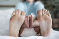 closeup mother's and newborn's feet at home Royalty Free Stock Photo