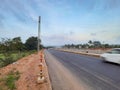 Motion blurred vehicle moving in the national highway roads of india