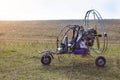 Closeup of moto paraglider on the field. Royalty Free Stock Photo