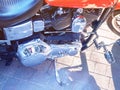 Closeup motorcycle engine side reflective metal. Light tinting
