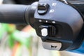 Closeup the motorcycle horn and switch off/on lighting on e-bike handlebar