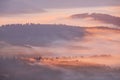 closeup mountain valley in dense mist at the sunrise