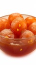 Closeup mouthwatering Gulab Jamun on a pristine white background.