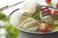 Closeup Mozzarella cheese and cherry tomatoes with spices. Homemade mozzarella cheese Royalty Free Stock Photo