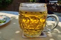 Closeup of a mug of beer on the table Royalty Free Stock Photo